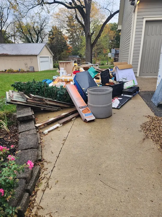 Dumpster being loaded with debris for Residential Dumpster Rental in Cortlandville